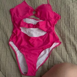 Shein brand pink one piece bathing suit in 2X. Fits smaller. 2 peekaboo areas.